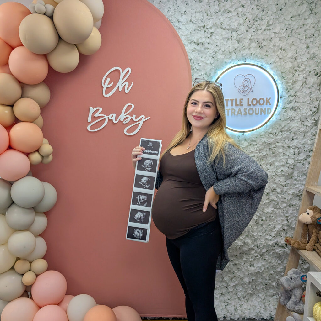 pregnant mom at 3d 4d ultrasound studio boutique in southern nh near ma appointment for Christmas holiday season